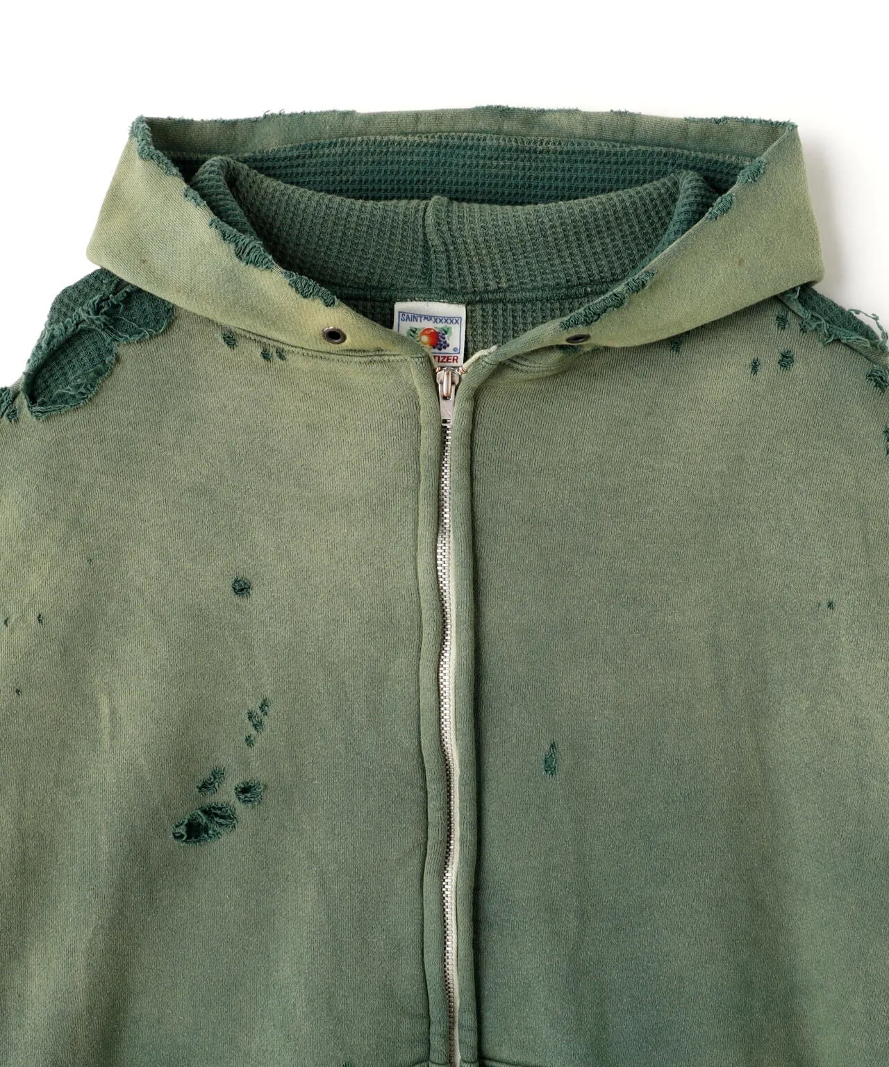 SAINT Mxxxxxx DBL FACE ZIP UP HOODIE/GREEN Double-layer destroyed waffle zipper jacket, washed green S-XL, a style that has been used in the summer. After continuous fine polishing, it has finally been shipped. The finished product is simply a work of art. Super heavy washing and distressing. Multiple water fades. Excessive hand-made wormhole destruction processing. Deconstruction and reorganization embroidery technology. Custom-made zippers with LOGO. The color details of the zipper webbing are also correct. Original grade fruit main label and wash water label. Top purchasing grade. A layer of waffle fabric is added to the inner lining to make the overall texture stronger and increase the comfort and warmth of the wearer.